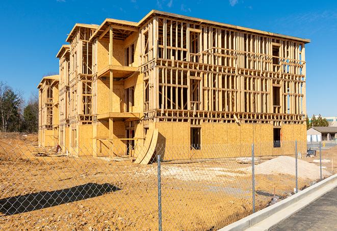 a close-up of temporary chain link fences enclosing a job site, signaling progress in the project's development in Brookfield OH